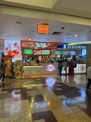 a food court in a mall with people walking around at Services Star Apartment At Times Square KL in Kuala Lumpur