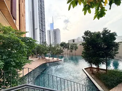 a river in the middle of a city with buildings at Lucentia Residence Bukit Bintang LalaportBBCC By VELLORA in Kuala Lumpur