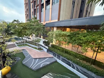 a view of a river in front of a building at Lucentia Residence Bukit Bintang LalaportBBCC By VELLORA in Kuala Lumpur