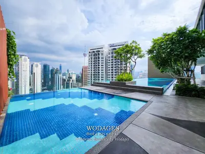 a swimming pool on the roof of a building at Majestic Residence KL by Wodages in Kuala Lumpur