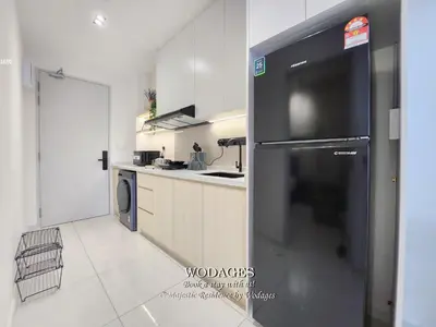 a kitchen with a black refrigerator in a room at Majestic Residence KL by Wodages in Kuala Lumpur