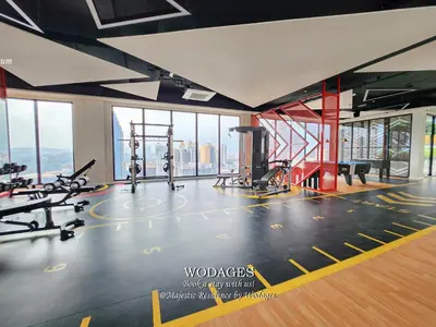 a gym with a view of the city at Majestic Residence KL by Wodages in Kuala Lumpur