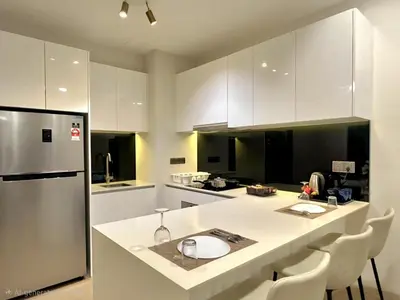 a kitchen with a white counter and a refrigerator at Urban Starscape 50450, KL in Kuala Lumpur