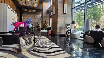 a lobby with a horse statue in the middle of a room at Urban Starscape 50450, KL in Kuala Lumpur