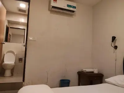 a small bathroom with a toilet and a sink at HOTEL NoVA in Kuala Lumpur