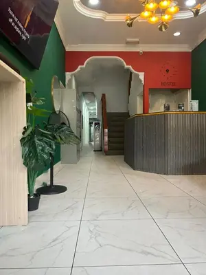 a lobby of a fast food restaurant with a counter at KING HOSTEL by Global Inn in Kuala Lumpur