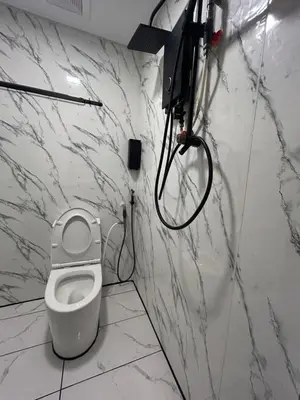 a bathroom with a white toilet in a room at KING HOSTEL by Global Inn in Kuala Lumpur