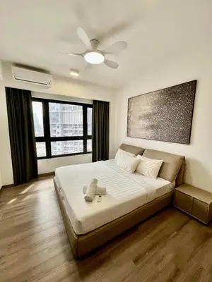 a bedroom with a bed and a ceiling fan at Residence Agile Apartment at kulalampur in Kuala Lumpur