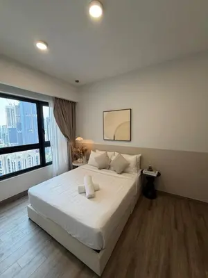 a bedroom with a large white bed and a window at Residence Agile Apartment at kulalampur in Kuala Lumpur