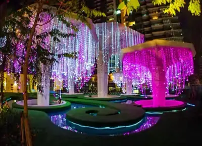 a group of trees with lights and lights at Affordable at Arte Plus near KLCC with WiFi and Parking in Kuala Lumpur