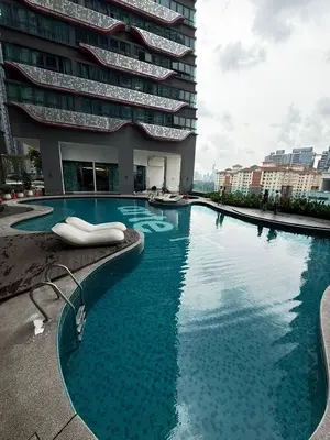 a large swimming pool in front of a building at Affordable at Arte Plus near KLCC with WiFi and Parking in Kuala Lumpur