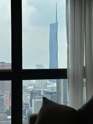a window with a view of a city at Agile Bukit Bintang, 54th Floor Apt, Infinity Pool in Kuala Lumpur