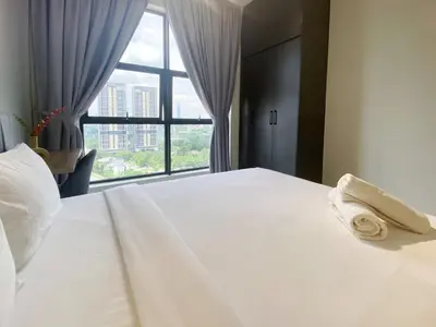 a bedroom with a large white bed with a window at Arte mont kiara by Paradigm Stay Free Parking in Kuala Lumpur