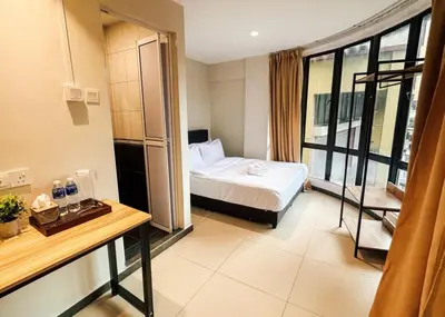 a hotel room with a bed and a window at Swing & Pillows - Sentul Jalan Ipoh Kuala Lumpur in Kuala Lumpur