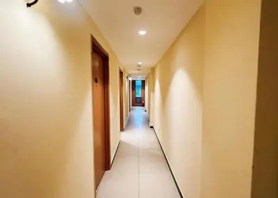 a hallway with a long corridor with a door at Swing & Pillows - Sentul Jalan Ipoh Kuala Lumpur in Kuala Lumpur