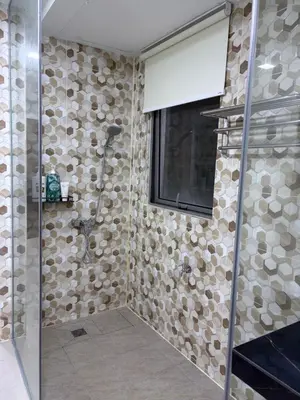 a bathroom with a shower with a glass door at Prime location in Bukit Bintang, Studio for 2 in Kuala Lumpur