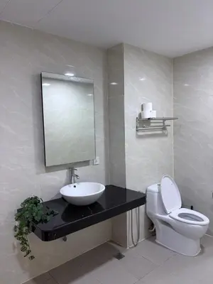 a bathroom with a sink and a toilet and a mirror at Prime location in Bukit Bintang, Studio for 2 in Kuala Lumpur