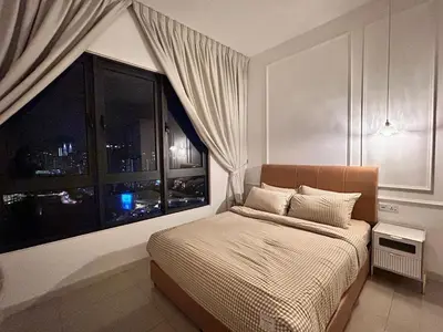 a bedroom with a bed and a large window at Savio Residence in Kuala Lumpur