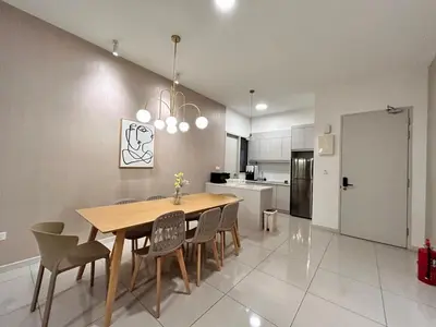 a kitchen with a dining room table and chairs at Savio Residence in Kuala Lumpur