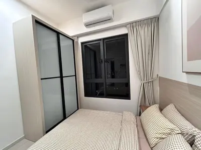 a small bedroom with a bed and a window at Savio Residence in Kuala Lumpur