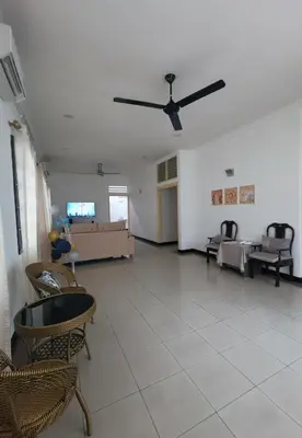 a living room with a couch and a ceiling fan at Sentul KL Private Cozy Bungalow Homestay - Free Parking & Wifi in Kuala Lumpur