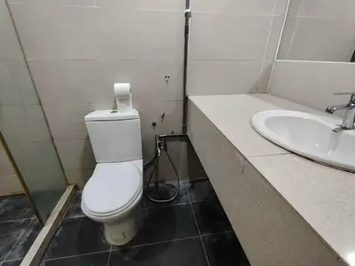 a bathroom with a toilet and a sink at Fahrenheit88 Suites Bukit Bintang A 2R in Kuala Lumpur