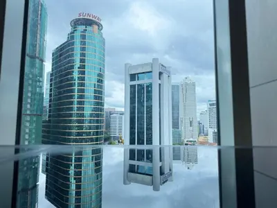 a view of a city skyline from a window at PLATINUM SUITES KLCC By CHENLUN in Kuala Lumpur