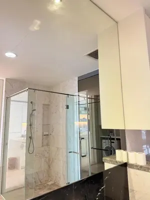 a bathroom with a shower with a glass door at PLATINUM SUITES KLCC By CHENLUN in Kuala Lumpur