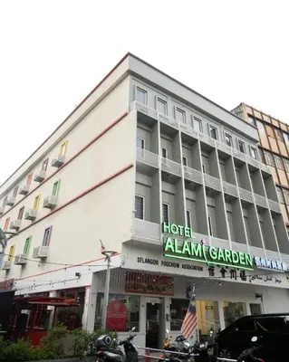 a hotel alamgard garden with motorcycles parked in front of it at Alami Garden Hotel Kuala Lumpur in Kuala Lumpur