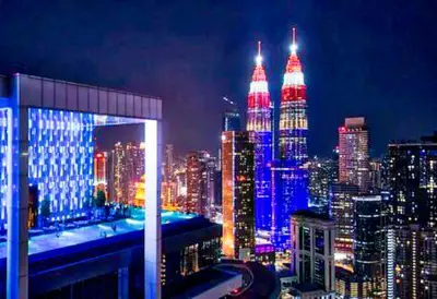a view of a city skyline at night at Platinum Suites in Kualalumpur City Center in Kuala Lumpur