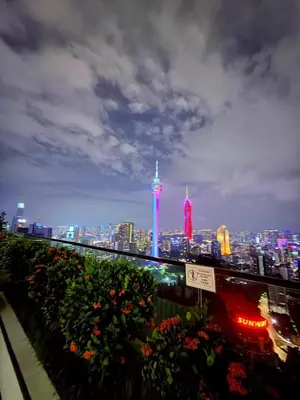 a view of the city at night with the oriental at Platinum Suites in Kualalumpur City Center in Kuala Lumpur