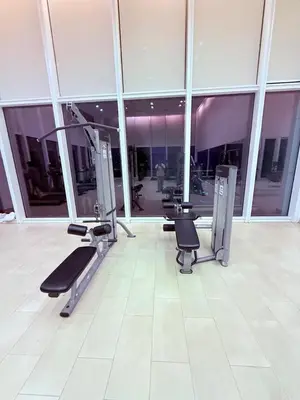 a gym with a row of treadmills in a building at Platinum Suites in Kualalumpur City Center in Kuala Lumpur