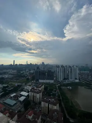 an aerial view of a city with a river and buildings at Rosewood Suites at Reizz Residence in Kuala Lumpur