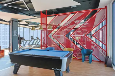 a pool table in a room with stairs at Majestic Residence KLCC Royal Premium King Bed in Kuala Lumpur