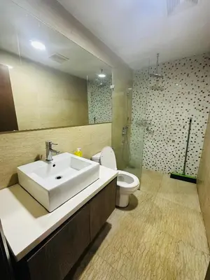 a bathroom with a sink and a toilet at Regalia Apartments By FA 3 in Kuala Lumpur