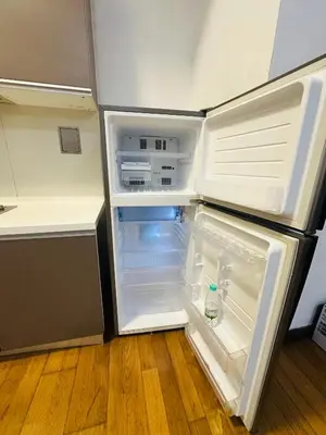 an empty refrigerator with its door open in a kitchen at Regalia Apartments By FA 3 in Kuala Lumpur