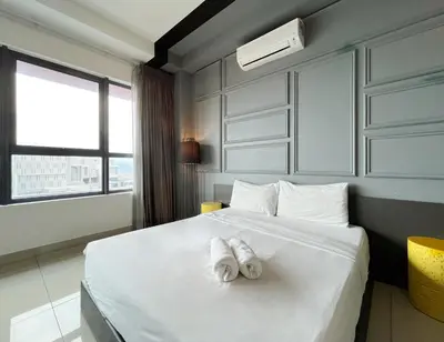a bedroom with a bed with two towels on it at Arte Plus Ampang Free Parking By Paradgm Stay in Batu Empat