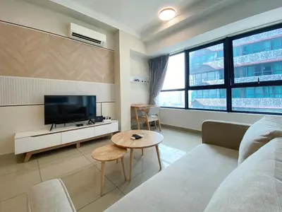 a living room with a couch and a tv and a table at Arte Plus Ampang Free Parking By Paradgm Stay in Batu Empat