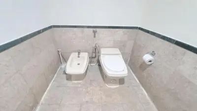a bathroom with a toilet and a bidet at BT Apartment times square kl in Kuala Lumpur