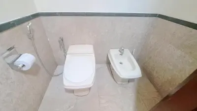 a bathroom with a toilet and a sink at BT Apartment times square kl in Kuala Lumpur