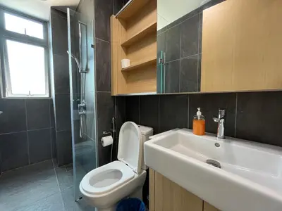 a bathroom with a toilet and a sink and a shower at The Colony By Infinitum By Paradgm Stay in Kuala Lumpur