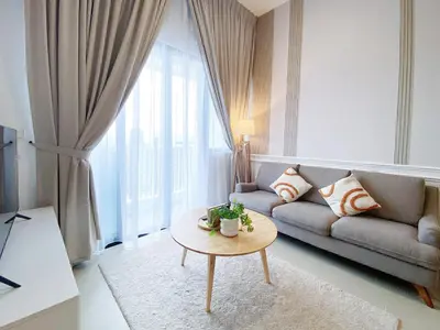 a living room with a couch and a table at The Colony Infinitum By Paradgm Nest Stay in Kuala Lumpur