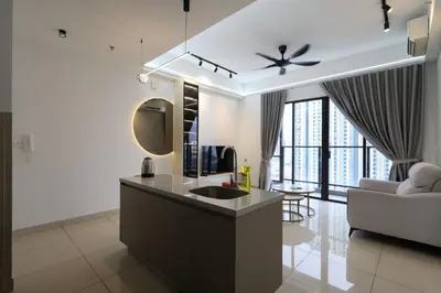 a kitchen with a sink and a living room at Trion KL By Paradgm Nest Stay Free Parking in Kuala Lumpur