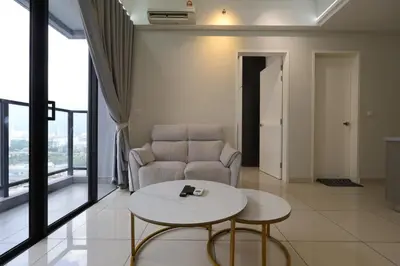 a living room with a couch and a table at Trion KL By Paradgm Nest Stay Free Parking in Kuala Lumpur