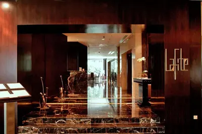 a lobby with a staircase in a building at High-Floor Suasana KL Stay Cozy & Central in Kuala Lumpur