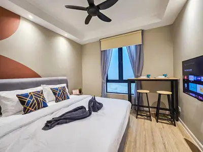 a bedroom with a bed and a ceiling fan at Casa Residency Family CityView Suites by CityNest in Kuala Lumpur