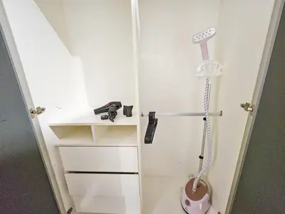a white bathroom with a shower in a room at Casa Residency Family CityView Suites by CityNest in Kuala Lumpur