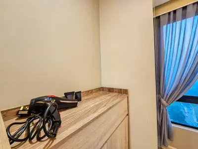 a room with a desk with a bike on it at Casa Residency Family CityView Suites by CityNest in Kuala Lumpur