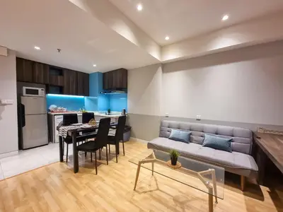 a living room with a couch and a table at KL City Designer Studio in D Majestic near LRT and Lalaport CityNest in Kuala Lumpur