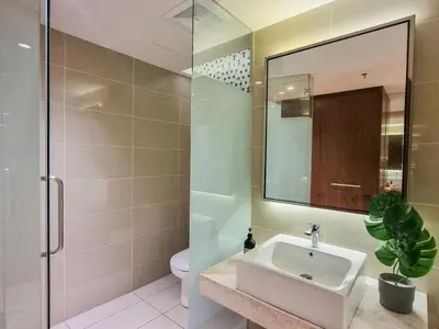 a bathroom with a sink and a toilet and a mirror at KL City Designer Studio in D Majestic near LRT and Lalaport CityNest in Kuala Lumpur
